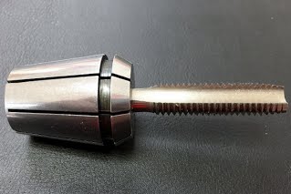 Standard tap shank with flute extending into the collet
